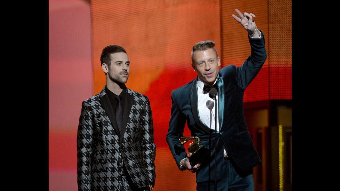 LOS ANGELES, CA - JANUARY 26:  Rappers Ryan Lewis (L) and Macklemore accept the Best New Artist award onstage during the 56th GRAMMY Awards at Staples Center on January 26, 2014 in Los Angeles, California.  (Photo by Kevork Djansezian/Getty Images)