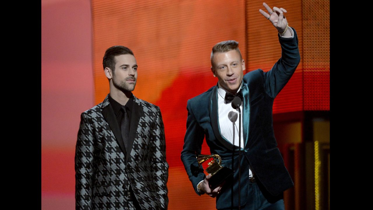 LOS ANGELES, CA - JANUARY 26:  Rappers Ryan Lewis (L) and Macklemore accept the Best New Artist award onstage during the 56th GRAMMY Awards at Staples Center on January 26, 2014 in Los Angeles, California.  (Photo by Kevork Djansezian/Getty Images)