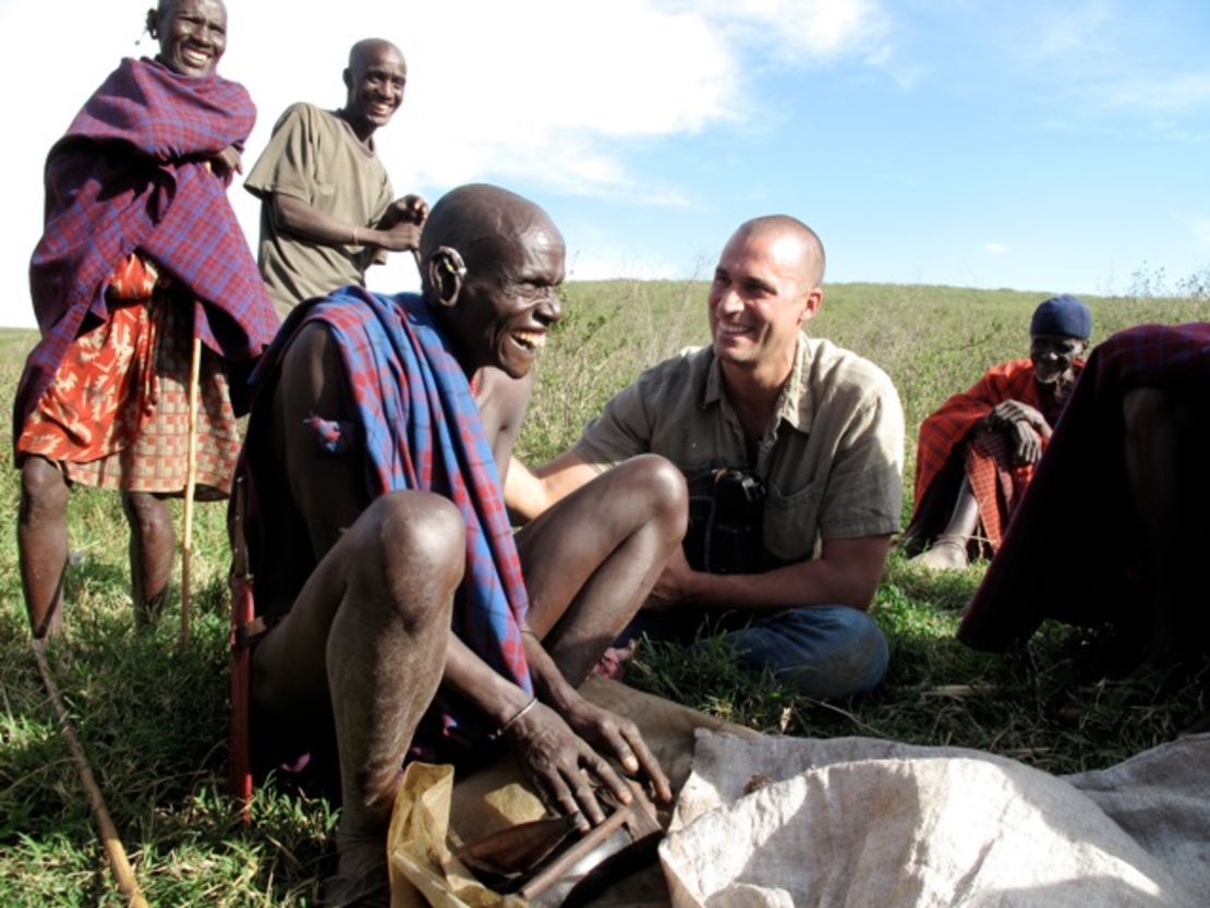 Nigel Barker trying to convince the local medicine man on the Maasai Steppe to let him speak to women in the tribe who deliver the babies.