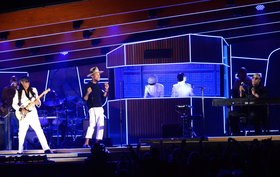 From left, Nile Rodgers, Pharrell Williams, Daft Punk and Stevie Wonder rock the crowd with a set that included the 2013 single "Get Lucky." The song won record of the year. Daft Punk also won album of the year for "Random Access Memories."