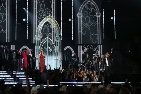 Mary Lambert joins Macklemore for the performance of "Same Love." Earlier in the night, Macklemore and Lewis won the Grammy for best new artist.