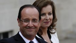 France's president Francois Hollande and his companion Valerie Trierweiler leave the Elysee presidential Palace in Paris, May 15, 2012.