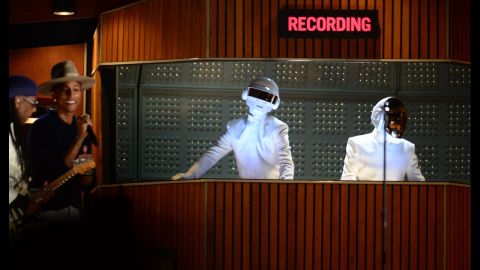 What's better than a pair of Francophone robots? A pair of Francophone robots in the sharpest, cleanest white suits we've ever seen. If this is the future, please sign us up.