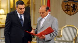 Tunisian President Moncef Marzouki (R) receives the list of members of the proposed government from premier-designate Mehdi Jomaa (L) during the new government presentation ceremony on January 26, 2014 in Carthage Palace in Tunis. Jomaa has presented the president with the list of his proposed cabinet of independents, under a roadmap aimed at ending months of political crisis. AFP PHOTO/FETHI BELAID (Photo credit should read FETHI BELAID/AFP/Getty Images)