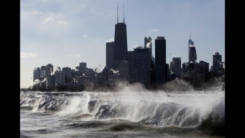 Ice forms as waves crash along the Lake Michigan shore January 27 in Chicago.