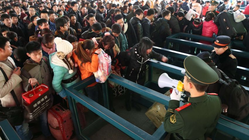 BEIJING, CHINA - JANUARY 26: (CHINA OUT) Passengers wait for trains at Beijing West Railway Station on January 26, 2014 in Beijing, China. The Chinese Spring Festival travel rush began on January 16 and about 3.62 billion passenger trips are expected to be made across the country, with around 257 million train trips during the 40-day lunar New Year travel period. (Photo by ChinaFotoPress/Getty Images)