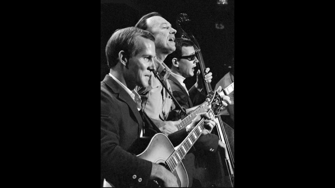 Seeger, center, appears as a musical guest on the Smothers Brothers Comedy Hour with Tom Smothers, left, and Dick Smothers in 1967.