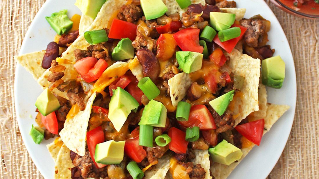 Instead of saturating your tortilla chips with copious amounts of cheese, choose <a href="http://memeinge.com/blog/healthy-loaded-nachos/" target="_blank" target="_blank">alternate toppings</a> for a leaner, more flavorful approach on these healthy loaded nachos.