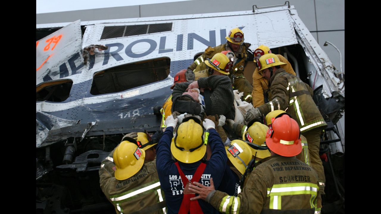 Rescue workers from Los Angeles tend to victims of an early morning Metrolink commuter train collision in Glendale, California, on January 26, 2005. Eleven people died and more than 180 were injured in the derailment, caused when Juan Manuel Alvarez parked his car on the tracks. Alvarez was convicted of murder and sentenced to 11 consecutive life terms in prison.