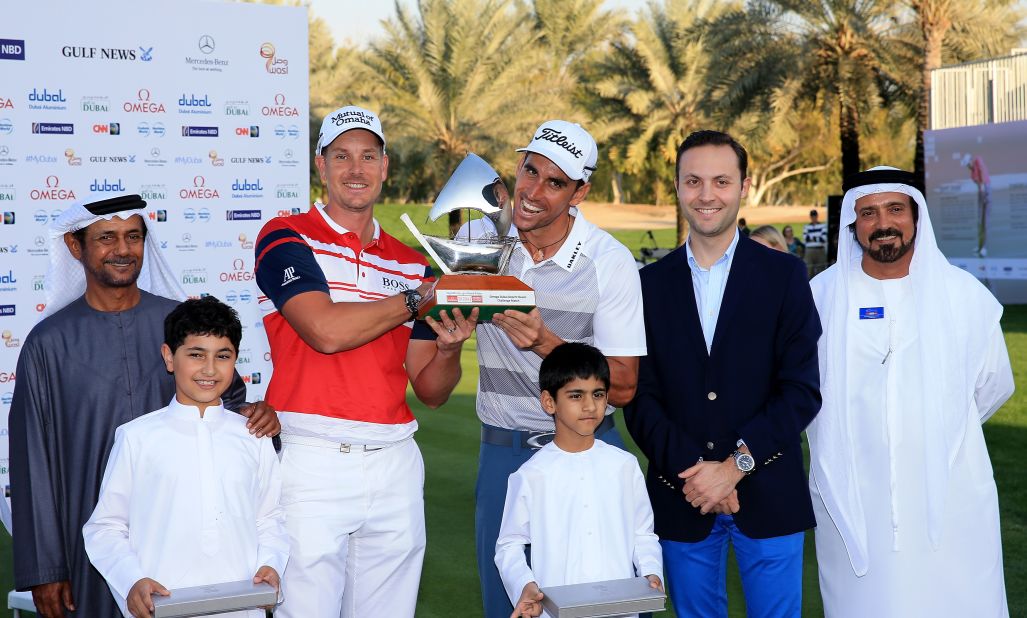 Sweden's Henrik Stenson and Rafa Cabrera-Bello of Spain share the Champions Challenge trophy after both finished six under par in the warm-up to Thursday's main event. 