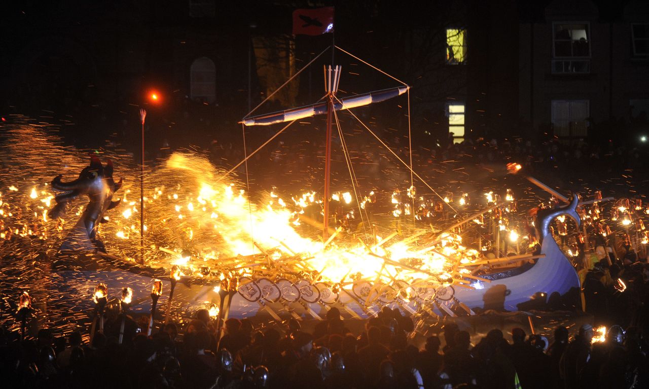 The pyromaniacal revelry ends in the setting ablaze of a replica Viking galley, suggesting ambivalent feelings toward the islanders' marauding Scandinavian forebears.