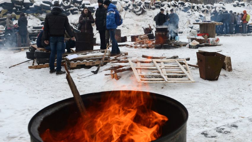 Anti-government protesters gather around fires near a barricade in the western Ukrainian city of Lviv on January 28, 2014, as they block the exit of "Berkut", special units of the Ukrainian police, to prevent their participation in clashes with the opposition in Kiev. AFP PHOTO/ YURIY DYACHYSHYNYURIY DYACHYSHYN/AFP/Getty Images