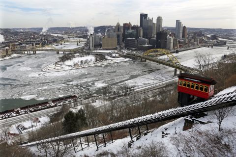 The Duquesne Incline climbs Mount Washington across the frozen Ohio, Allegheny and Monongahela rivers in downtown Pittsburgh on January 28.