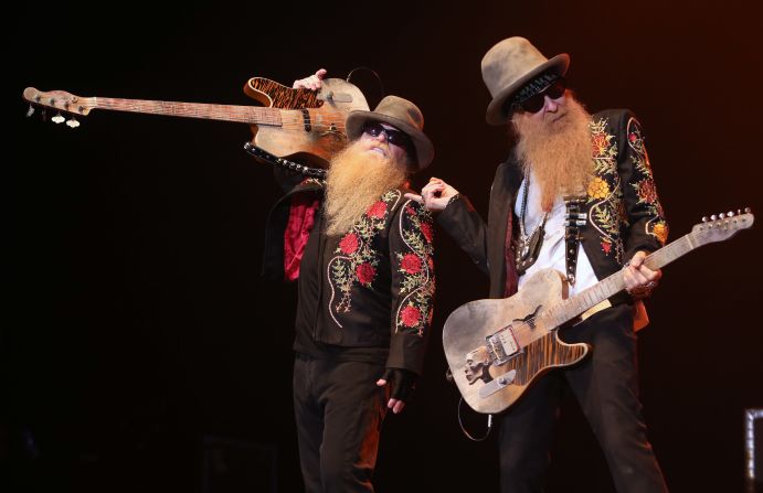 Rockers ZZ Top canceled its entire fall 2014 tour after the band's bassist, Dusty Hill, injured his hip in a fall on a tour bus. Here Hill, left, and Billy Gibbons perform in 2013 in Epernay, France.