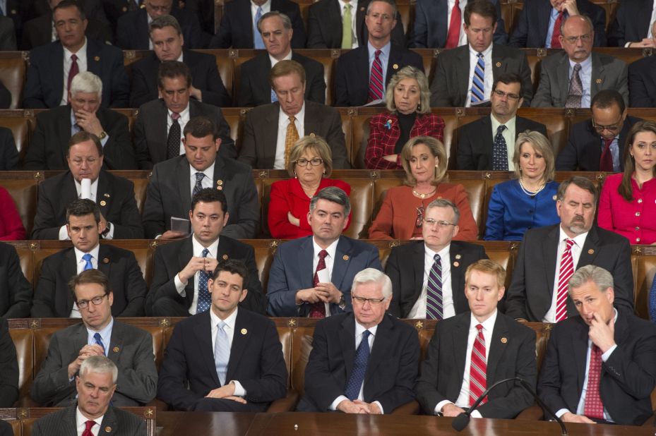 Republican senators and representatives listen to President Barack Obama's speech during the State of the Union.