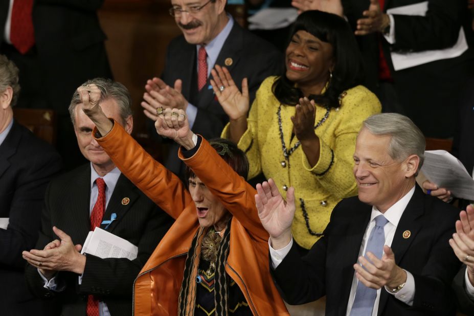 Rep. Rosa DeLauro, D-Connecticut, center, and Rep. Terri Sewell, D-Alabama, cheer during Obama's speech.