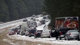 Vehicles sit backed up on a snow covered US Highway 280 in Chelsea, Alabama, on January 28.