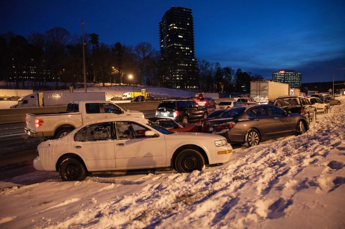 Abandoned vehicles in Dunwoody, Georgia, line Interstate 285 early on January 29.