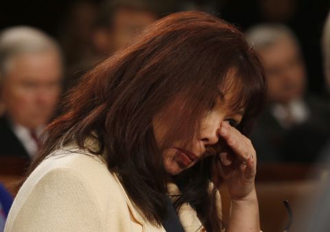 U.S. Rep. Tammy Duckworth wipes away tears during a standing ovation at the State of the Union address for Army Sgt. Cory Remsburg, who was severely wounded while serving in Afghanistan. Duckworth, herself, was also seriously wounded in Iraq while serving as a helicopter pilot.