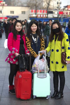Zhai Xixi (R) and her friends are sophomore students at China Central Academy of Fine Arts in Beijing. The 20-year-olds hope to be painters. They're returning to Linfen in Shanxi province. 