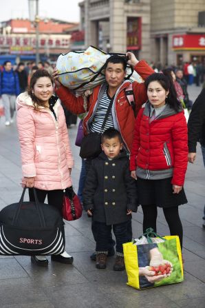 Li Hangyu (center) with his five-year-old son, his wife and sister. For the last four years they have run a small business in Zhangjiakou, Hebei province.