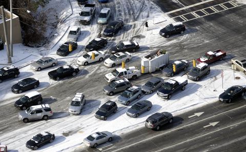 Abandoned cars are piled up on the median of an ice-covered road in Atlanta on January 29.