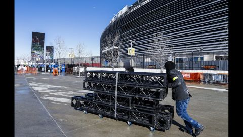 A man moves equipment outside MetLife Stadium in East Rutherford on January 29. The stadium will host the game Sunday.