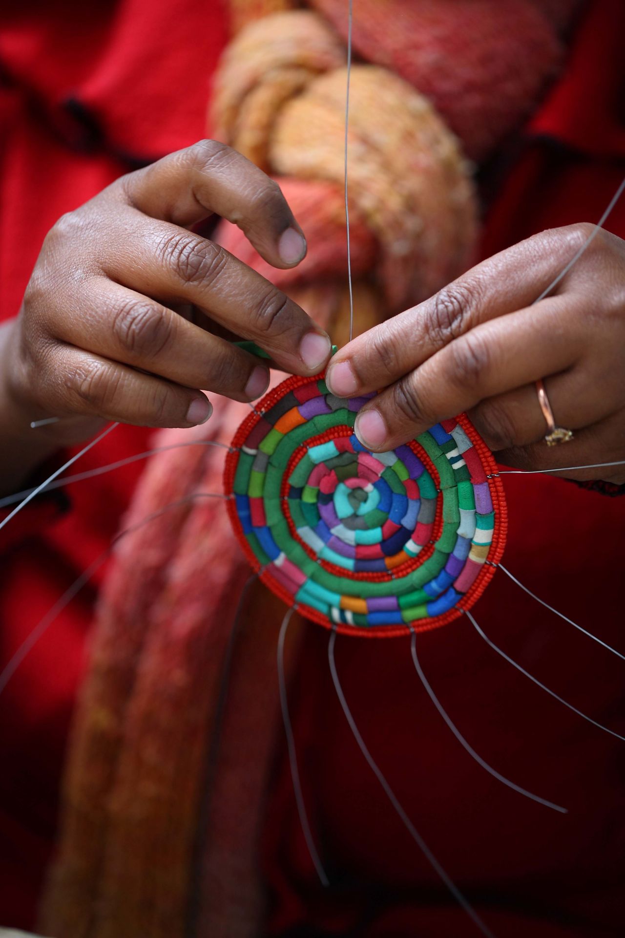 Already used by local children to make toys, Church encouraged their mothers to collect and clean the flip-flops and turn them into colorful products.