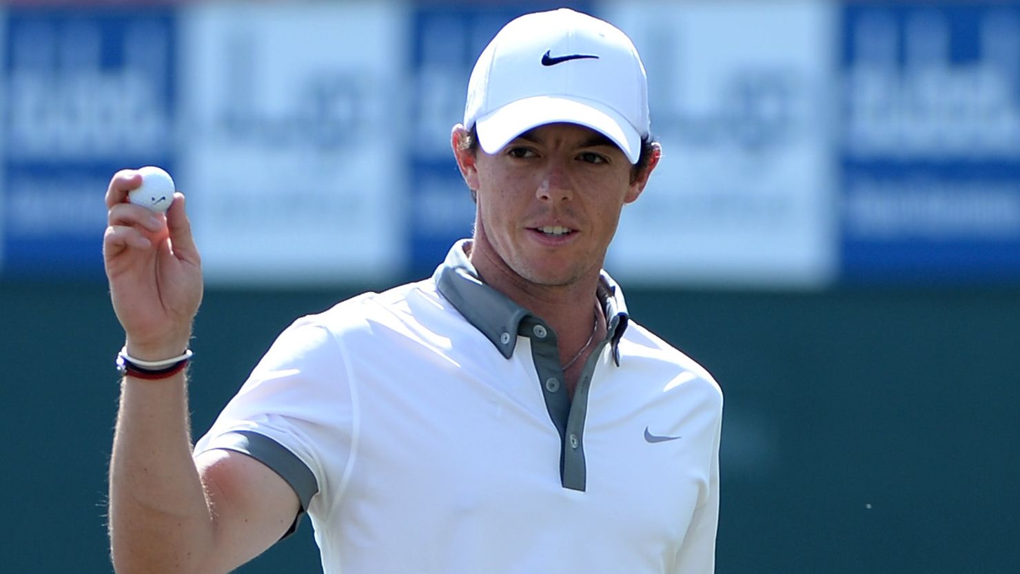 Rory McIlroy acknowledges the galleries after picking up another birdie during his nine-under-par 63 in Dubai.