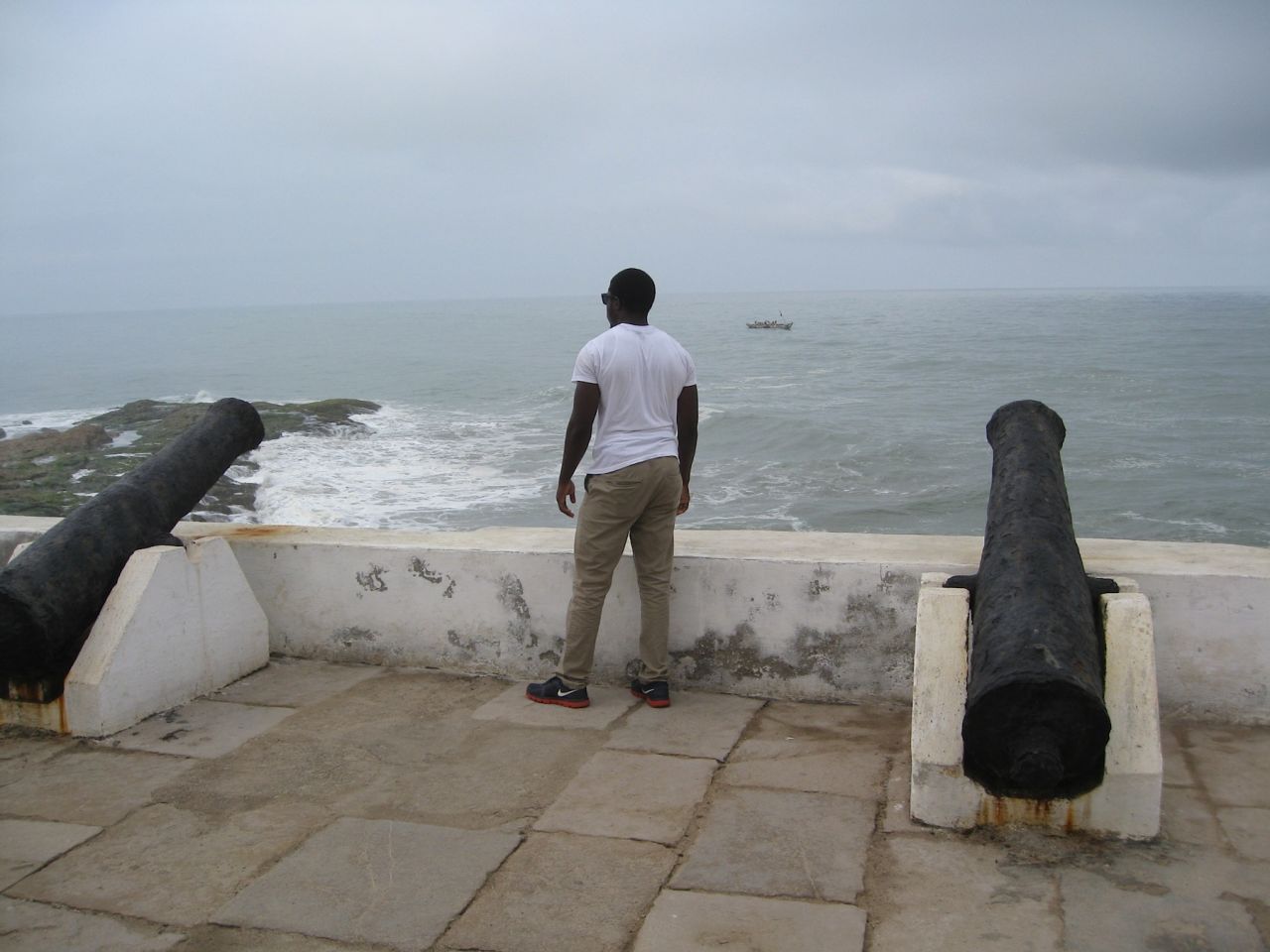 Duwon Steven Clark stares out to the Atlantic from Cape Coast Castle --one of more than two dozen slave "castles" along the coast of what is now Ghana.