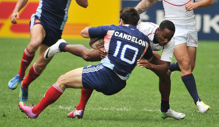 France's Julien Candelon is on the receiving end of a tackle by Isles during last year's Hong Kong Sevens tournament. 