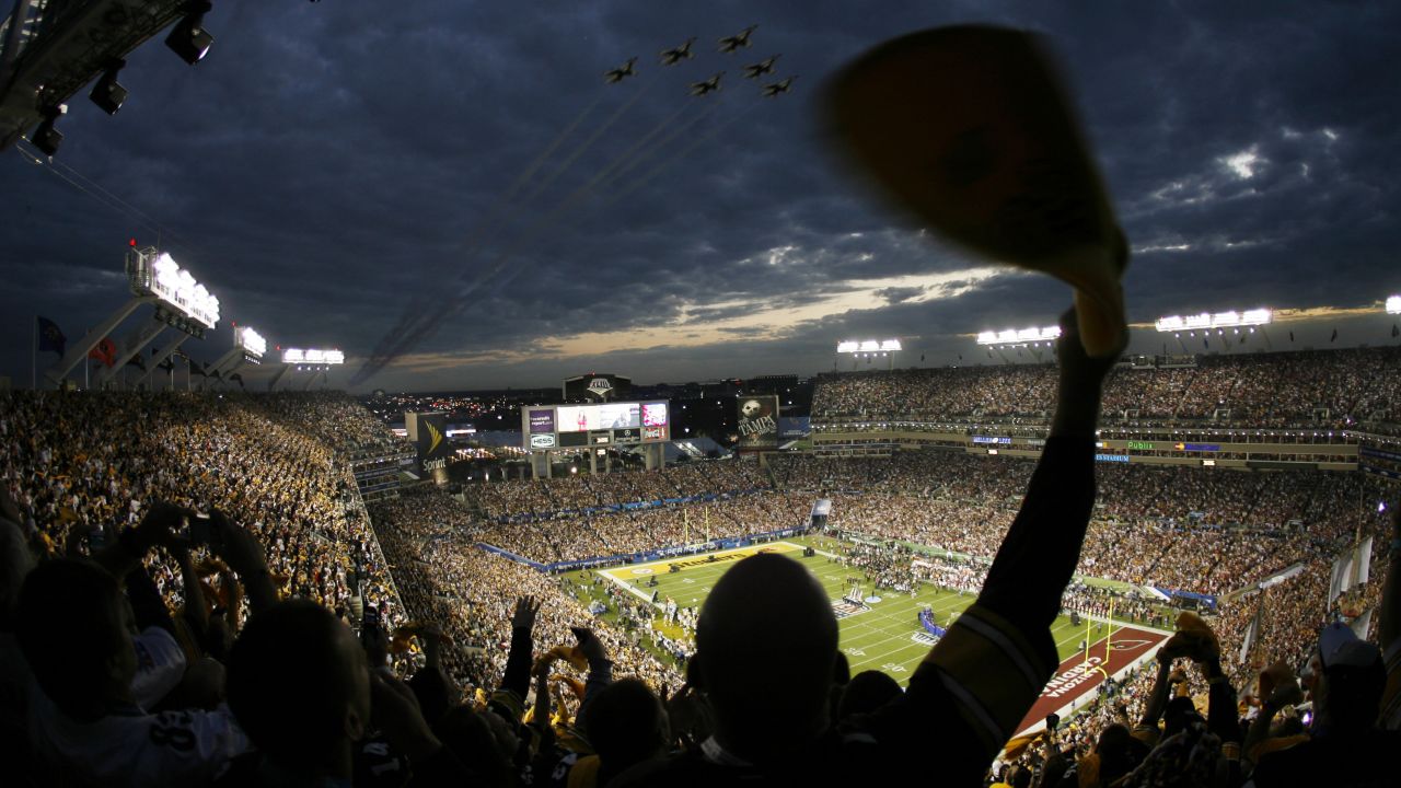 Super Bowl XLIII attendees cheer as the U.S. Air Force Thunderbirds fly over Raymond James Stadium in Tampa, Florida, in 2009.