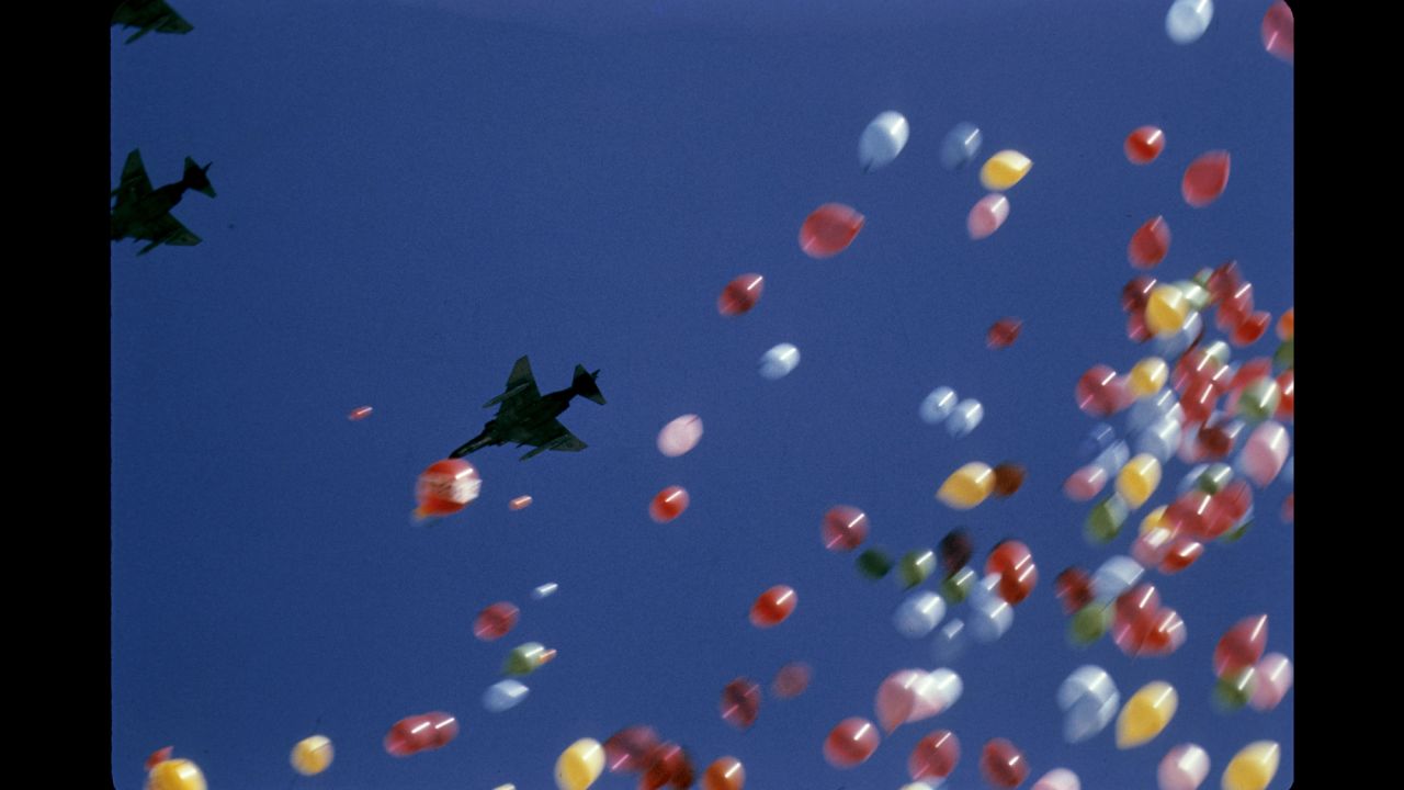 Balloons fill the sky as F-4 Phantom fighter jets fly over Tulane Stadium in New Orleans before Super Bowl VI in 1972.