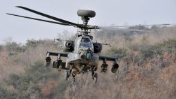 A US Apache helicopter takes to the air during an aerial gunnery exercise at a military firing range in Pocheon, near the heavily-fortified border with North Korea, on January 23, 2009.  The new US administration will make North Korea's nuclear disarmament a priority despite other pressing world problems, South Korea's chief nuclear negotiator said.  AFP PHOTO/JUNG YEON-JE (Photo credit should read JUNG YEON-JE/AFP/Getty Images)
