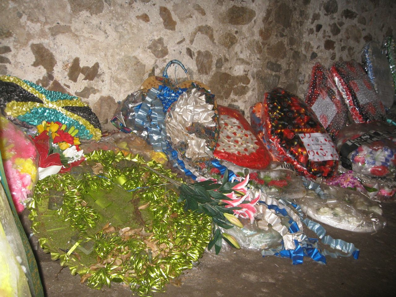 Gifts line the walls on the women's dungeon. The guide says they are left by descendents of slaves who have come back to understand their ancestors' enslavement, and to honor their them.