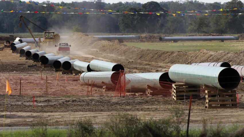 File - In the is Oct. 4, 2012 file photo, large sections of pipe are shown on a neighboring property to Julia Trigg Crawford family farm, in Sumner Texas. On Wednesday, Jan 22, 2014, TransCanada said in a statement on its website that it is delivering oil through the Gulf Coast portion of its proposed Keystone XL pipeline, from a hub in Cushing, Okla., to Houston-area refineries. (AP Photo/Tony Gutierrez, file)