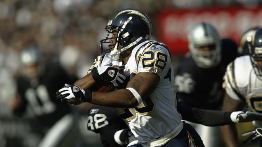 Ronney Jenkins carries the ball in a 2002 game against the Oakland Raiders.