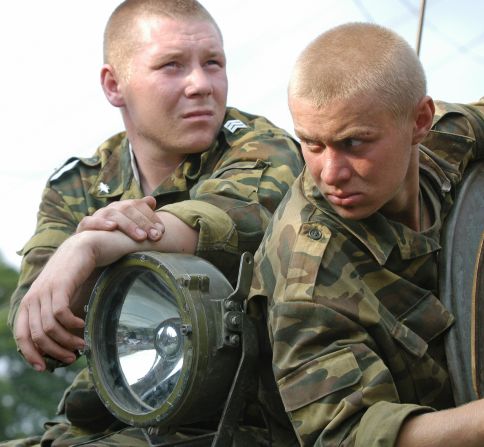 Soldiers wait in position near the school in Beslan. Russian commandos took over the school and freed many hostages on the third day of the siege.