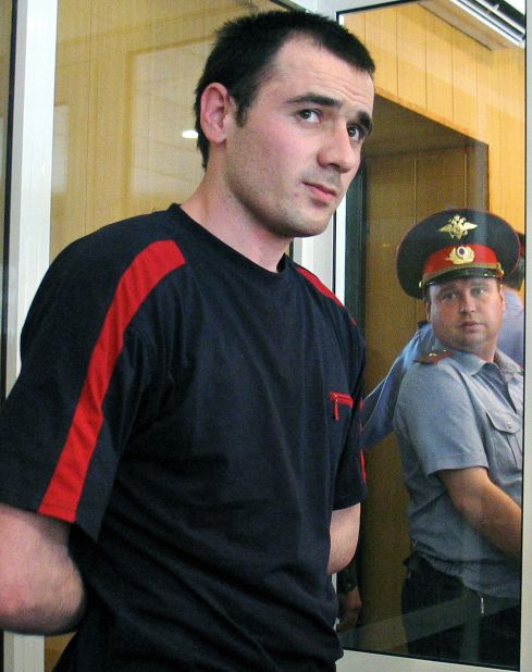 Nurpashi Kulayev stands in the defendant's cage during the proceedings of his trial in Vladikavkaz, May 24, 2006. Kulayev was the only surviving terrorist responsible for a terrorist act staged at the school.  He was found guilty of terrorism and other charges and sentenced to life in prison.
