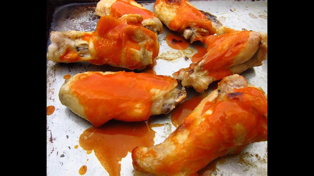 Most buffalo chicken wings are deep-fried and loaded with fat and calories. <a href="http://snack-girl.com/snack/healthy-buffalo-chicken-wings-recipe/" target="_blank" target="_blank">This fitter option</a> calls for boiling and baking the wings. 