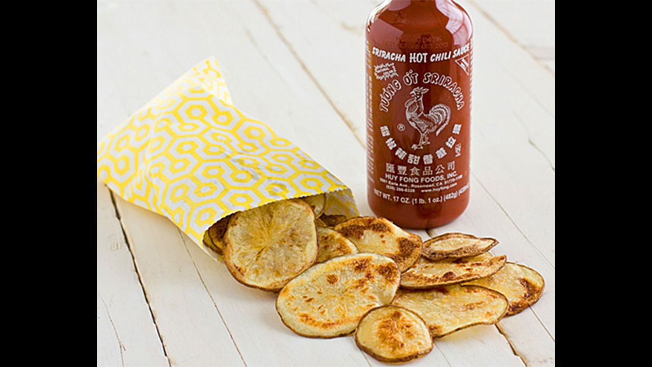 Don't forget the chips! Sriracha gives homemade potato chips a kick. You just need a Russet potato, sriracha, peanut oil and salt. 