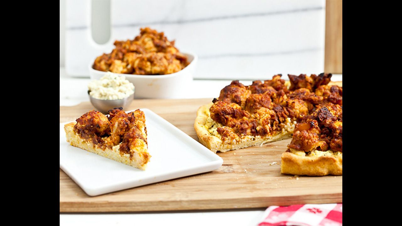 Vegans at your game party? Try buffalo-cauliflower wing pizza with tofu-blue cheese spread. Roasting cauliflower makes it crunchy and chewy, not rubbery.