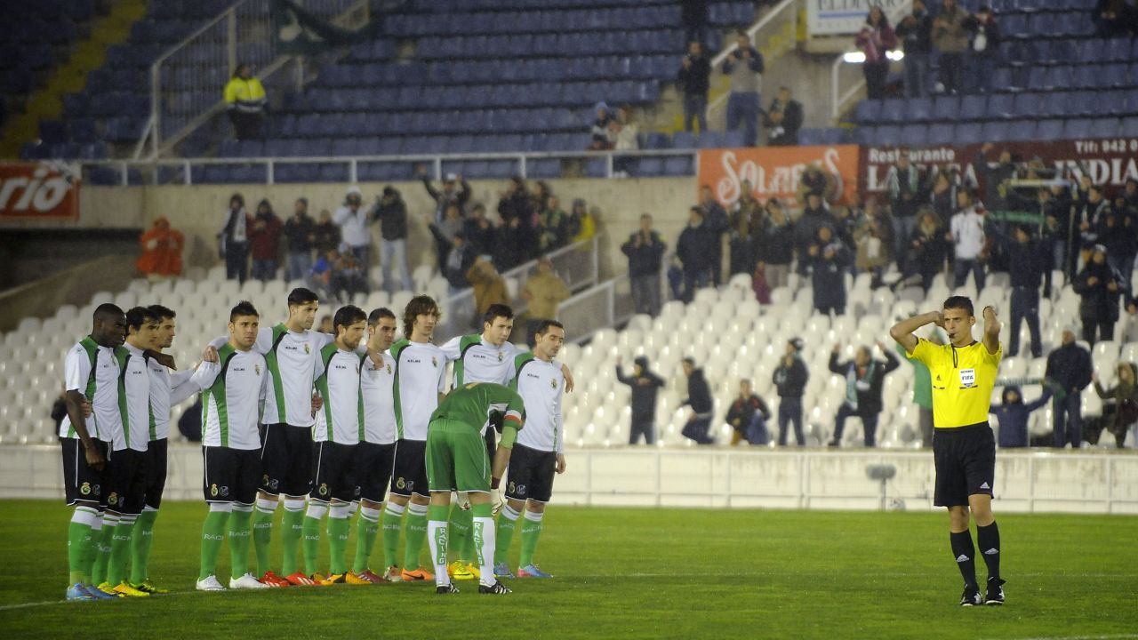 Referee whistles the end of the game few minutes after it started as players of third-tier Spanish side Racing Santander refused to play in their Copa del Rey quarterfinal, second leg against Real Sociedad in a dispute with the club's president Angel Lavin over unpaid wages, at El Sardinero stadium in Santander on January 30, 2014.  AFP PHOTO/ ANDER GILLENEAANDER GILLENEA/AFP/Getty Images