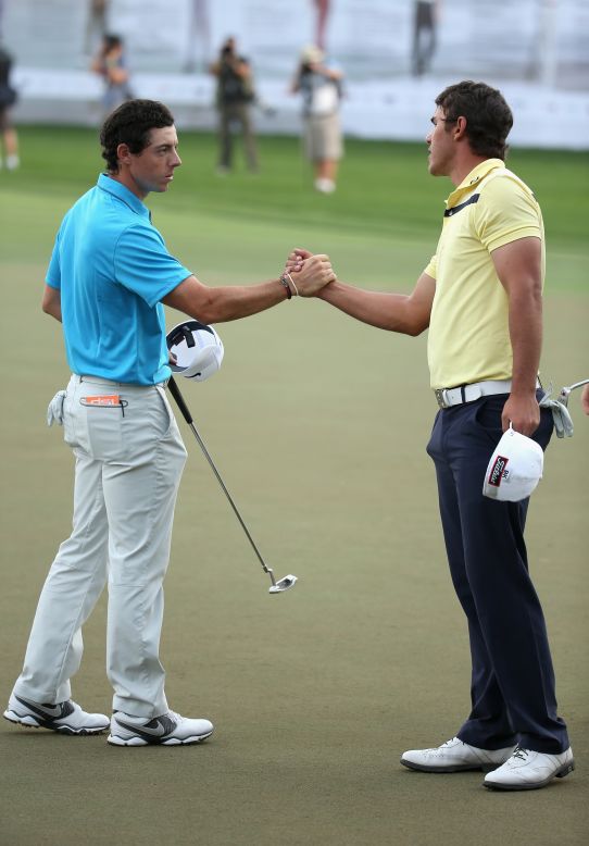 McIlroy, the 2009 Dubai winner, shakes hands with third-placed playing partner Brooks Koepka of the U.S. 