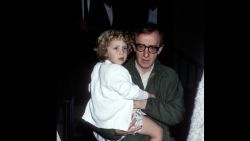 Woody Allen carries  Dylan O'Sullivan Farrow near Allen's aparment in New York City on May 2, 1989.