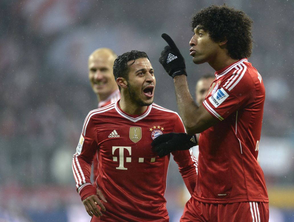 Thiago congratulates defender Dante after he scored Bayern's fourth goal in the victory over Frankfurt.