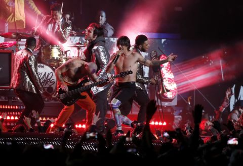 The Red Hot Chili Peppers join Mars on stage for a rendition of "Give It Away."