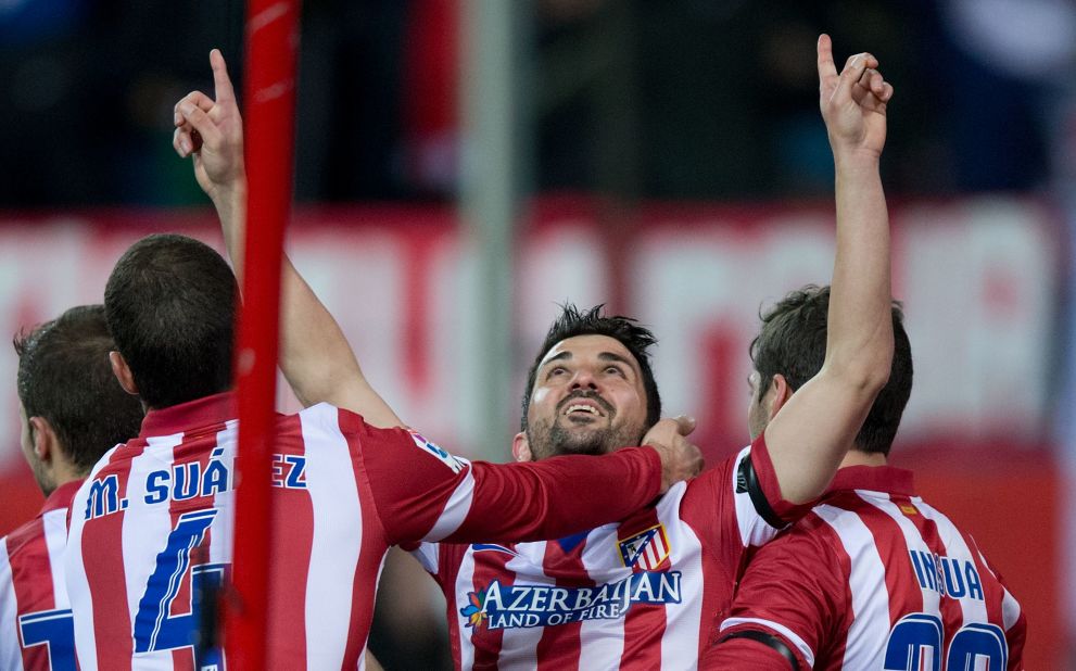 David Villa pays his own emotional tribute to his former Spain national coach Aragones after scoring Atletico's opener.  