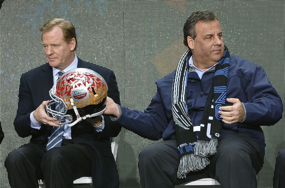New Jersey Governor Chris Christie takes a welcome break from recent political controversies to share a moment with NFL Commissioner Roger Goodell in the build up to Super Bowl XLVII.