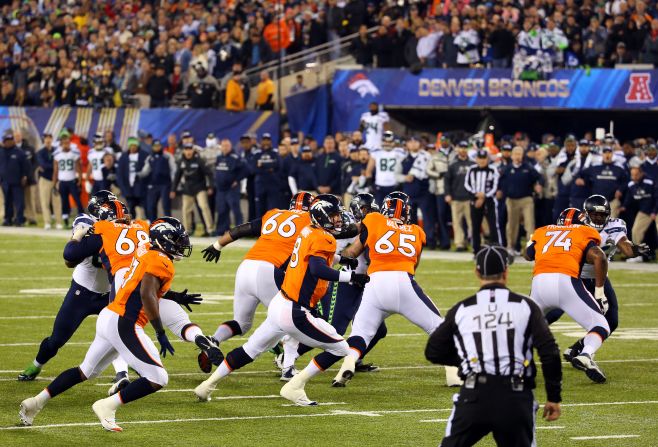 Denver makes a disastrous start as the ball sails over Peyton Manning from a snap which leads to a safety and points on the board for Seattle. 